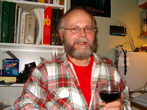 Hannu with a glass of wine in his hand